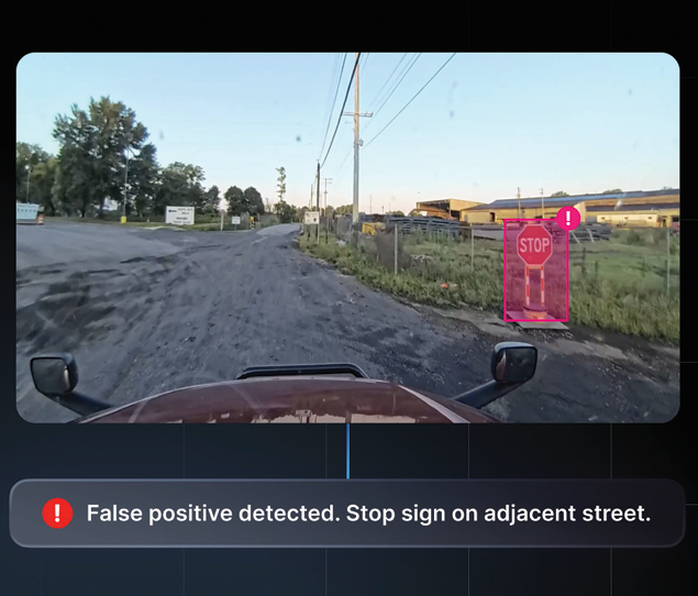 Motive AI dashcam identifying a false positive safety event and recognizing a stop sign on an adjacent roadway.